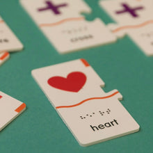Load image into Gallery viewer, Memory Puzzle: Shapes puzzle piece with a heart design. Tactile printing with Braille and English.