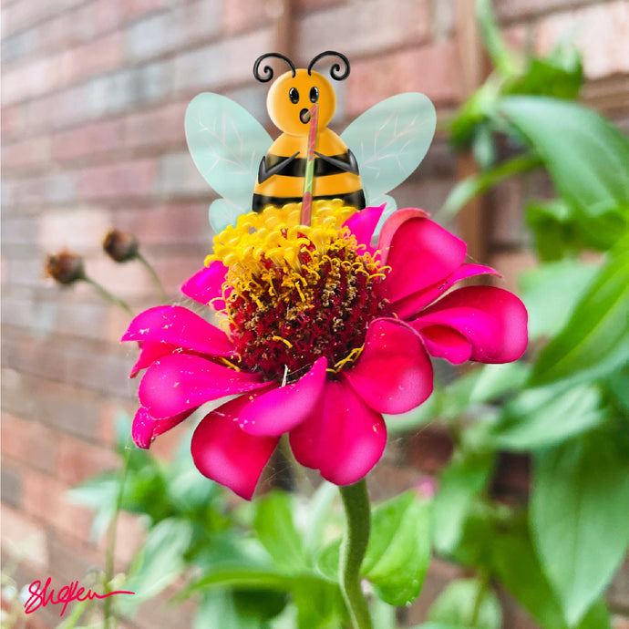 This mini puzzle is a digital composition of a  cute honey bee character using a straw to drink from a pink flower